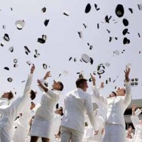 US coast guard academy graduates dressed white