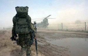 Soldiers fully equipped goes to helicopter
